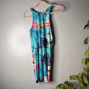 This Tori Richard tropical print dress is a vibrant resortwear piece featuring a